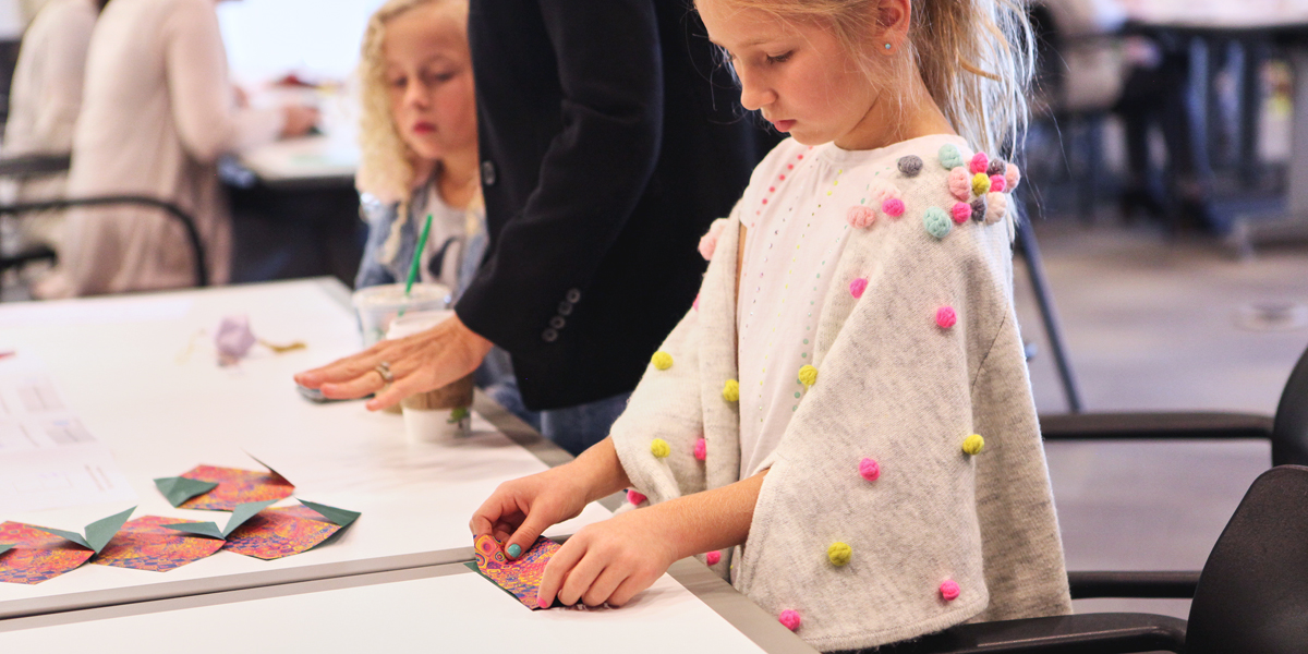 Fossil Group employees and their families had the opportunity to shop and fold origami for Paper For Water