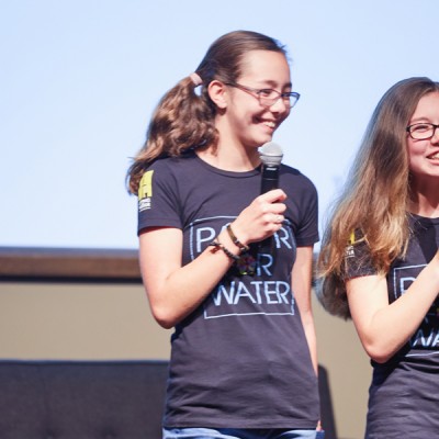 Isabelle and Katherine Adams of Paper For Water spoke to a crowd of employees and their families at Fossil Group in Richardson TX