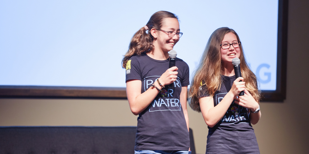 Isabelle and Katherine Adams of Paper For Water spoke to a crowd of employees and their families at Fossil Group in Richardson TX 