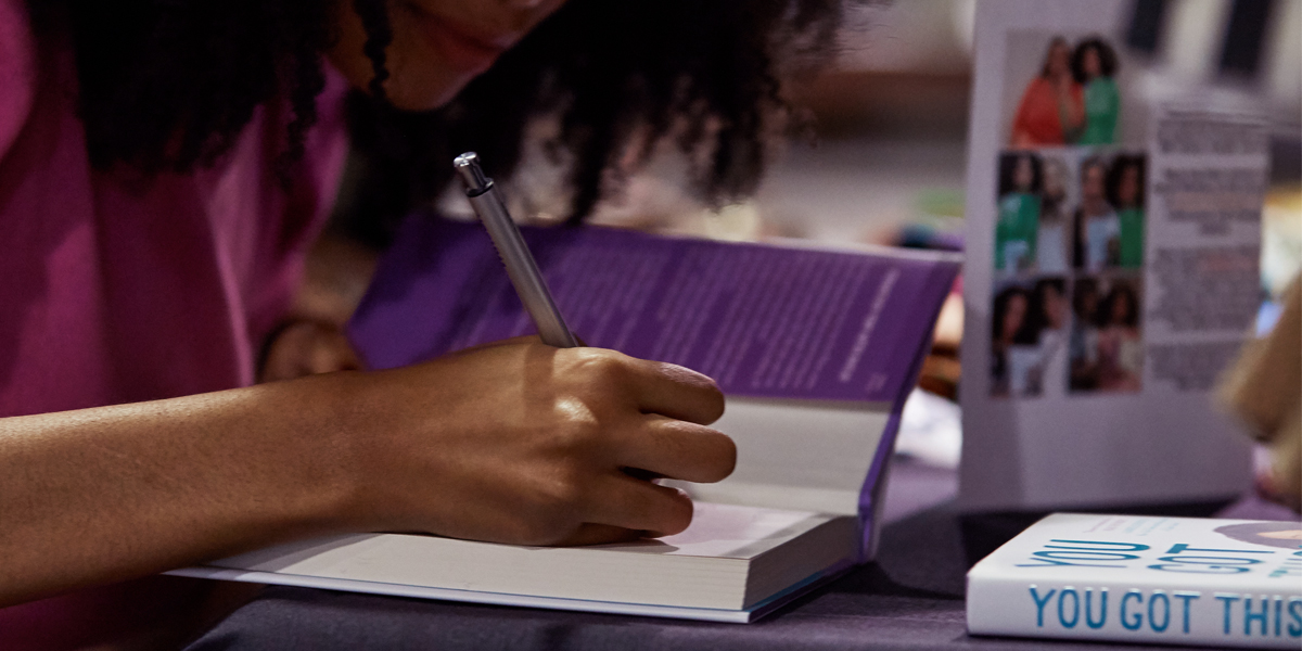 Maya Penn signs copies of her book, You Got This