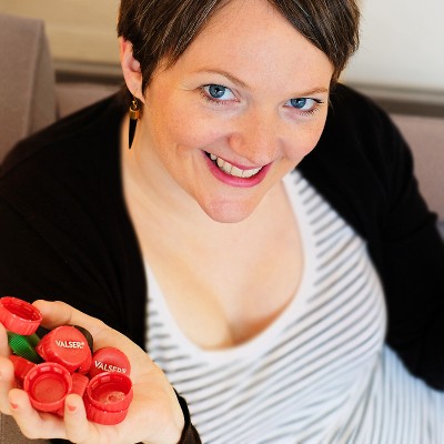 Claire Stolz collects plastic bottle caps at the Fossil Group office in Basel Switzerland