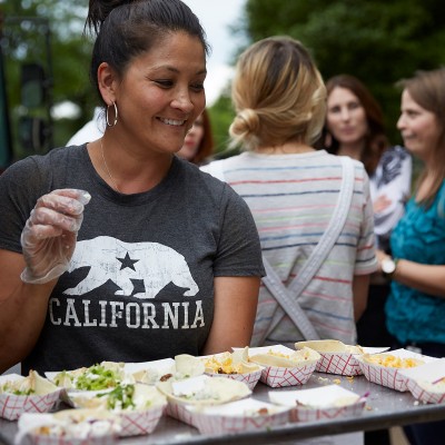 Food truck owner serves tacos at Fossil Group annual spring fest