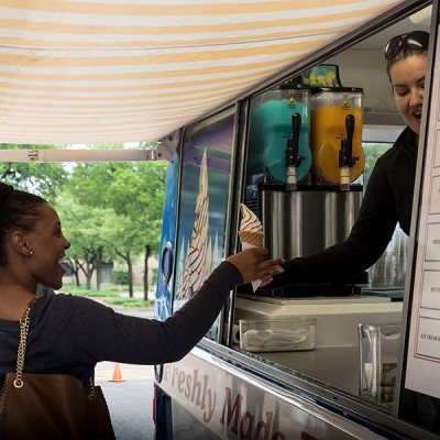 Fossil Group employee gets soft serve ice cream from food truck
