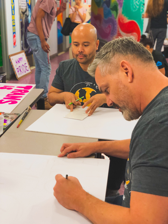 Fossil Group and Hetrick Martin employees make posters for NYC pride parade