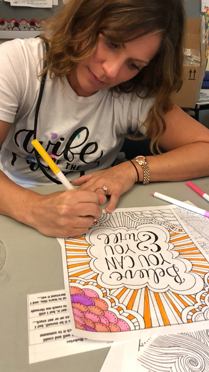 Fossil Group and Hetrick Martin employees make posters for NYC pride parade
