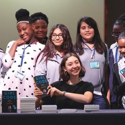 Sophie Houser poses with local students at IDG event in Texas