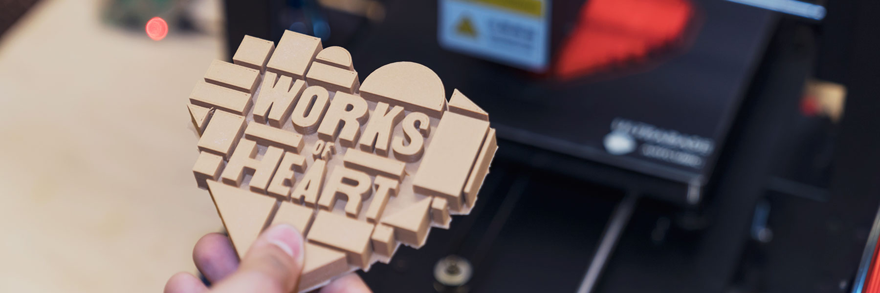 3-D printed Works of Heart logo